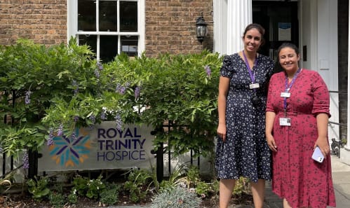 marta and joana, 2 community dementia nurses standing in front of the hospice