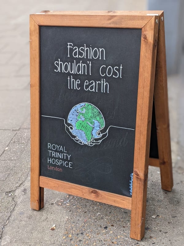 Shop blackboard that says Fashion shouldn