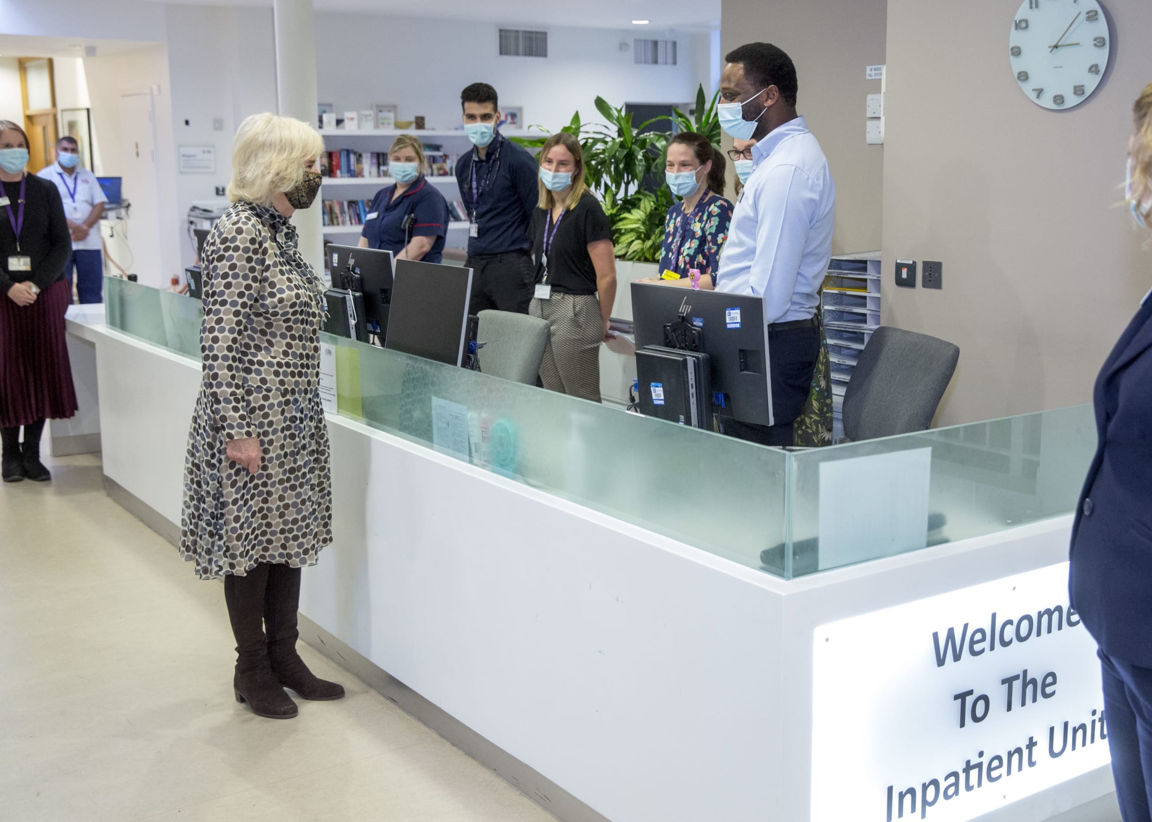 Her Majesty The Queen Consort speaking to staff on the Trinity Inpatient Unit reception desk